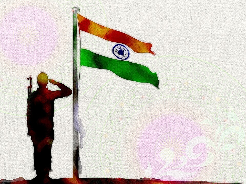 a man praying infront of indian flag